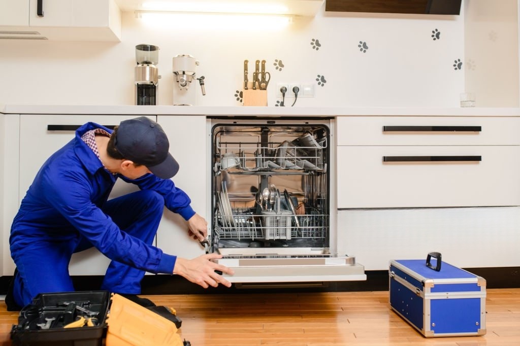 man repair appliance